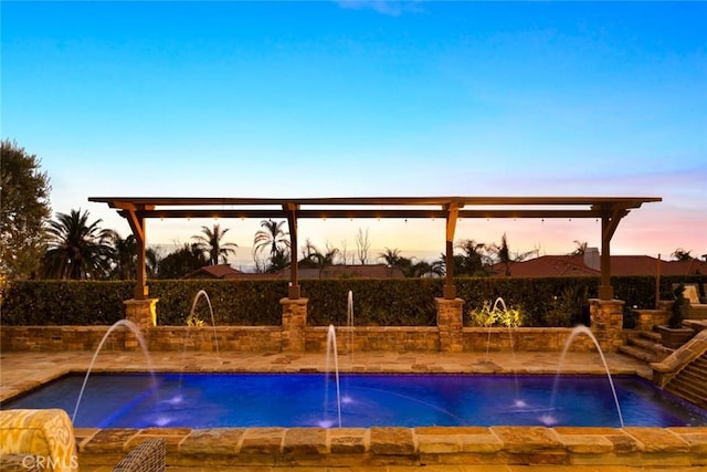 view of pool at dusk