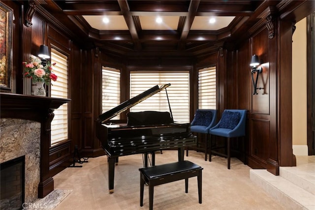 miscellaneous room with wooden walls, coffered ceiling, a high end fireplace, light colored carpet, and beamed ceiling