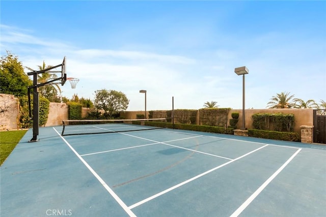 view of sport court featuring basketball hoop