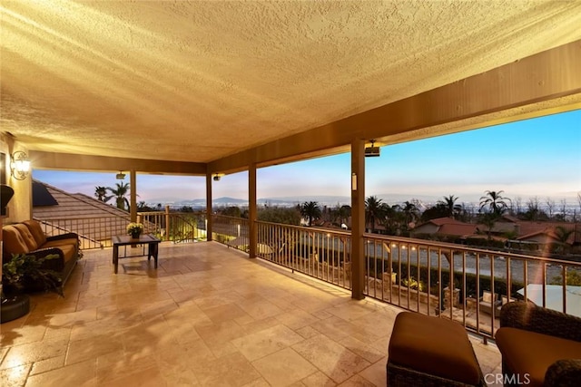 view of patio terrace at dusk