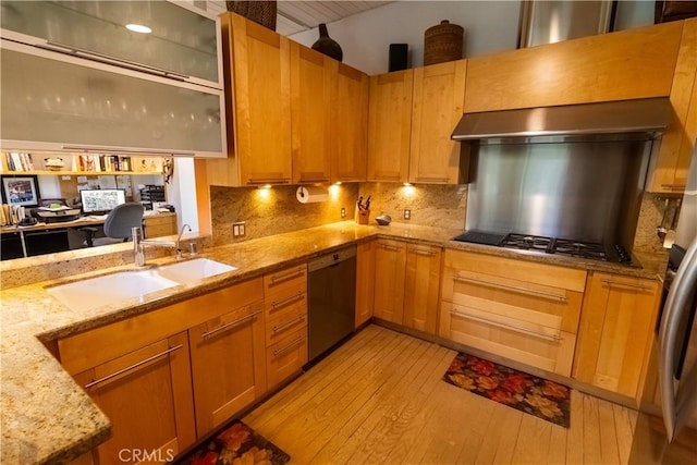 kitchen with dishwasher, sink, decorative backsplash, light stone counters, and light wood-type flooring