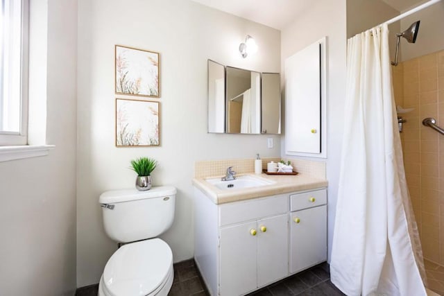 bathroom featuring tile patterned flooring, vanity, a shower with shower curtain, and toilet