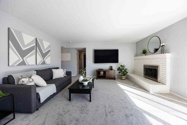 living room featuring carpet floors and a brick fireplace