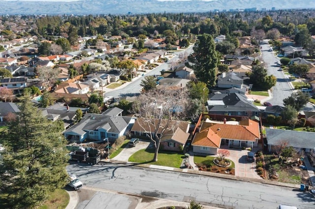 birds eye view of property with a mountain view