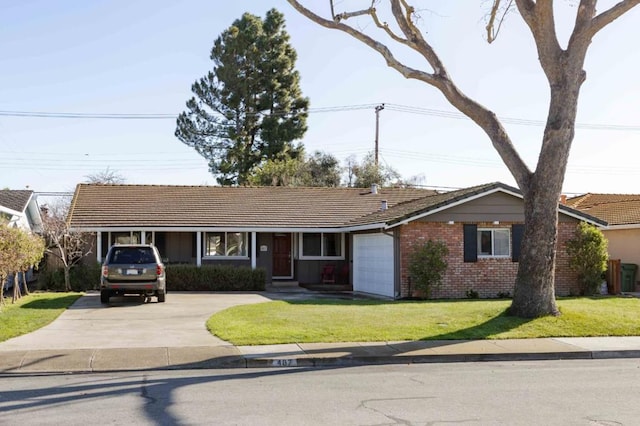 ranch-style house featuring a garage and a front lawn