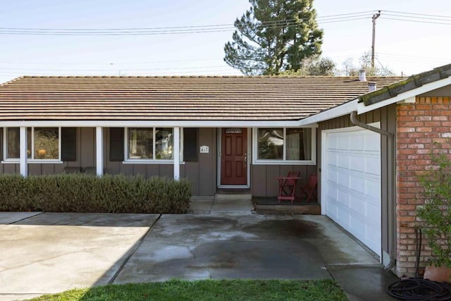 ranch-style house featuring a garage