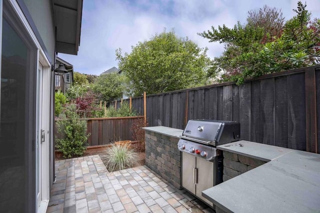 view of patio / terrace featuring an outdoor kitchen and grilling area