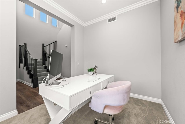 carpeted office space with crown molding