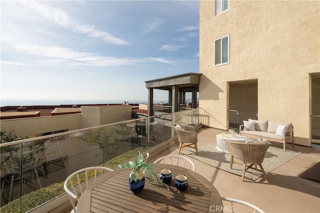 balcony with a patio area and outdoor lounge area