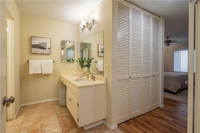 bathroom with vanity and ceiling fan