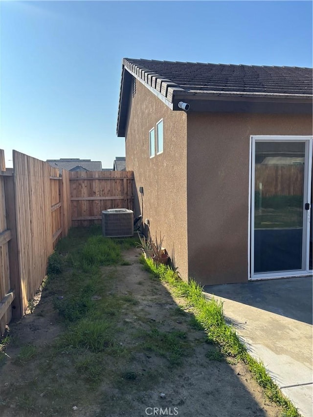 view of side of home with cooling unit