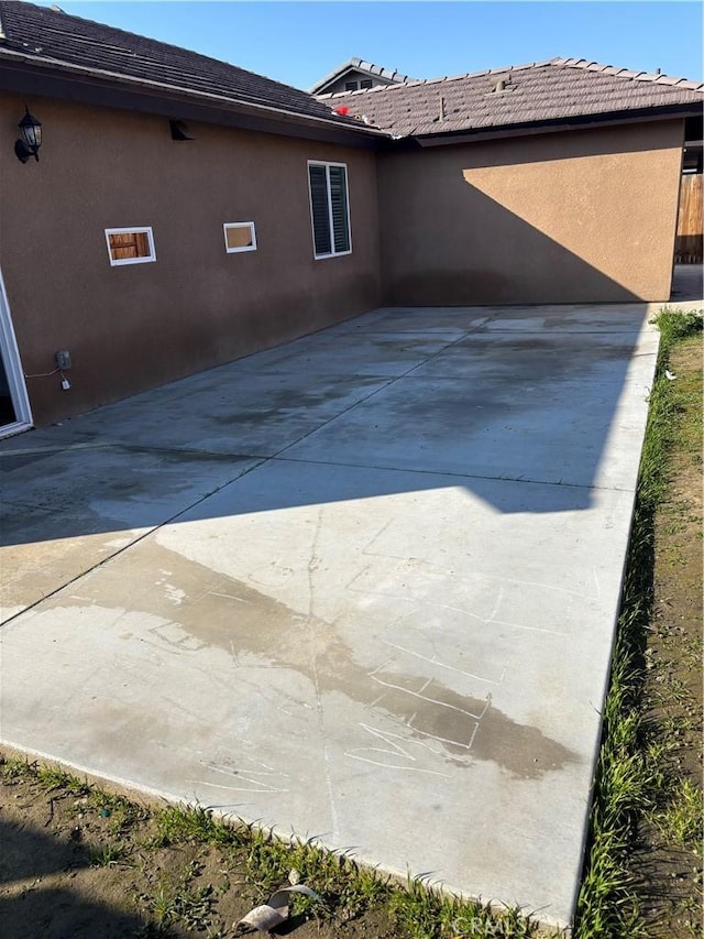 rear view of house featuring a patio