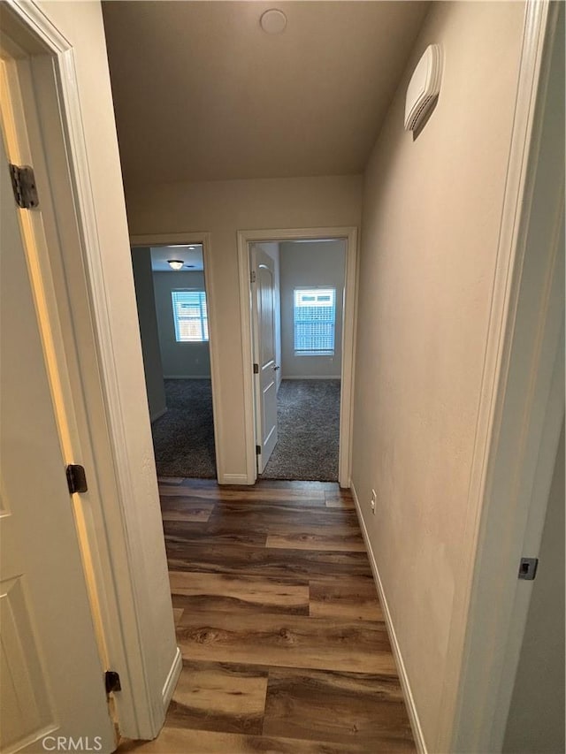 hall with dark hardwood / wood-style floors