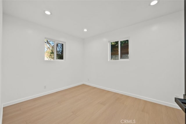 unfurnished room featuring light hardwood / wood-style floors