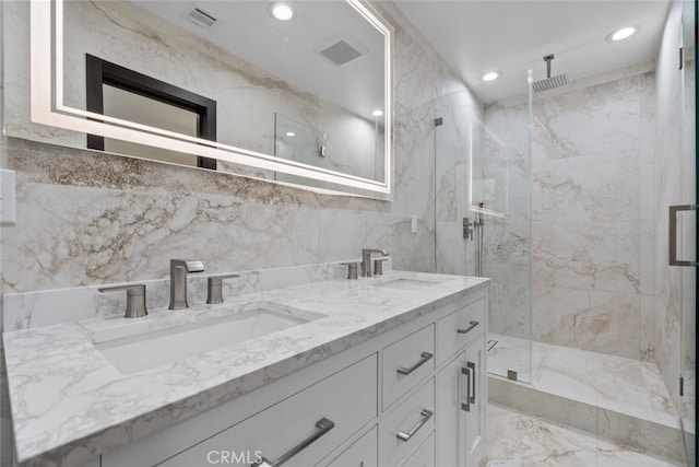 bathroom featuring vanity, tile walls, and walk in shower