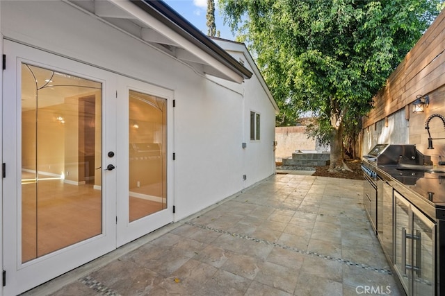 view of patio with sink and french doors