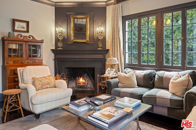 sitting room with a brick fireplace