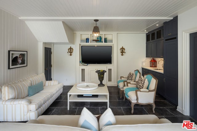 tiled living room featuring sink