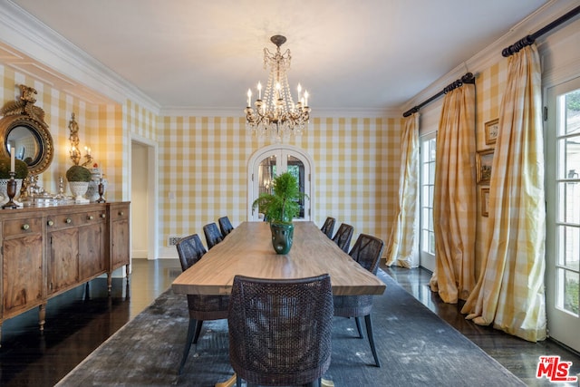 dining room featuring crown molding, dark hardwood / wood-style floors, a chandelier, and french doors