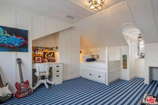 bedroom with vaulted ceiling and carpet