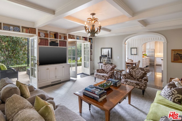 living room featuring coffered ceiling, beam ceiling, crown molding, and a chandelier