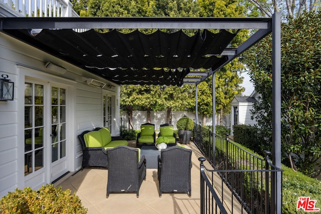 view of patio featuring a pergola, outdoor lounge area, and french doors