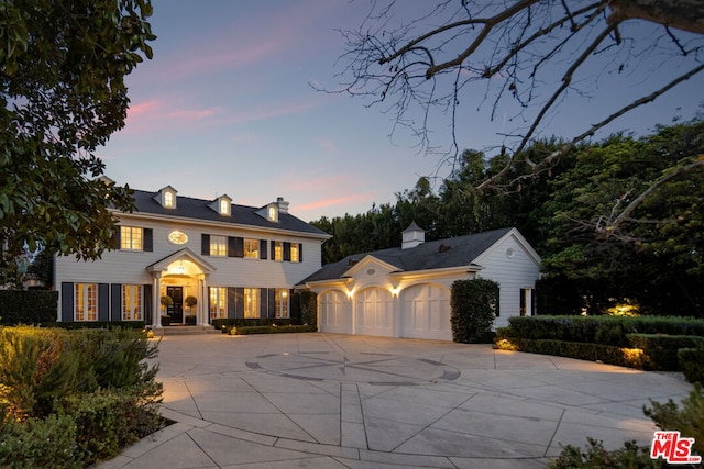 colonial inspired home with a garage