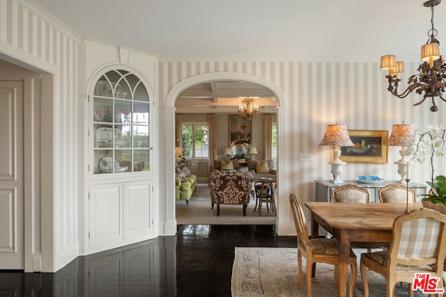 dining room with an inviting chandelier and dark hardwood / wood-style flooring