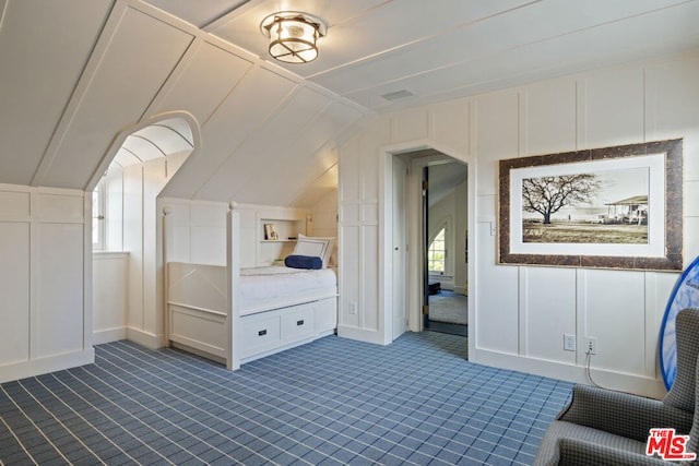 bedroom featuring lofted ceiling