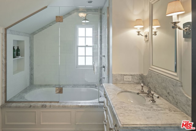 bathroom with vanity and combined bath / shower with glass door