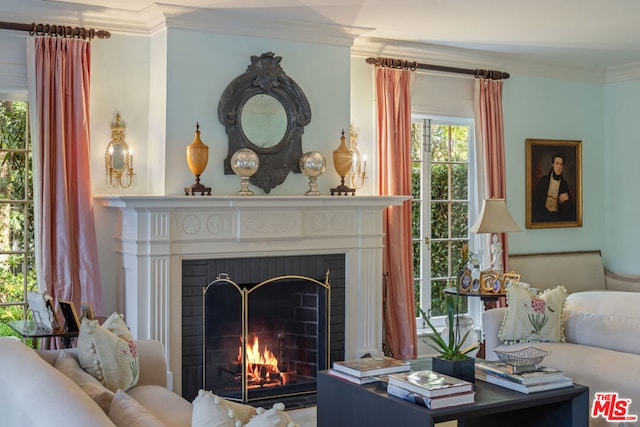 interior space featuring crown molding and a fireplace