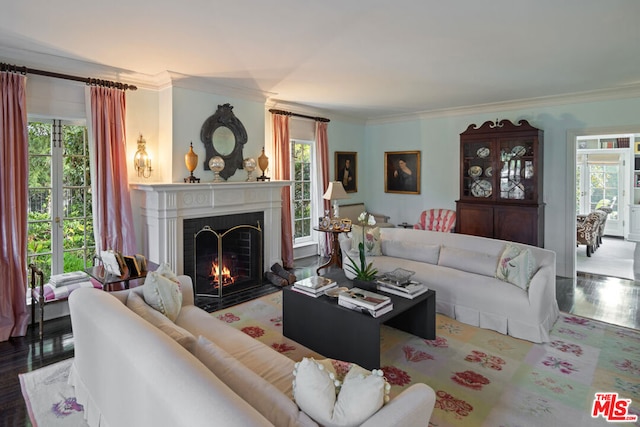 living room featuring hardwood / wood-style flooring and ornamental molding