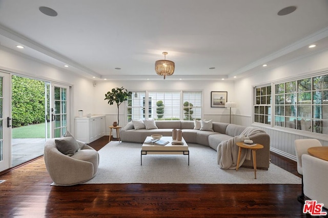 living room featuring french doors, dark hardwood / wood-style floors, and crown molding