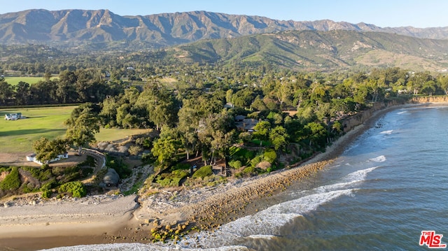 birds eye view of property with a water and mountain view