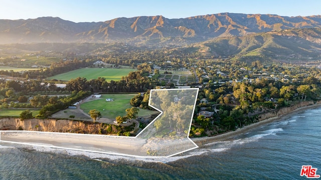 aerial view featuring a water and mountain view