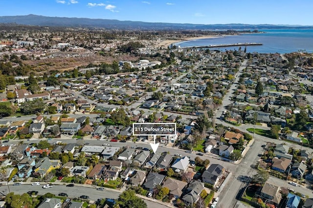 aerial view featuring a water and mountain view