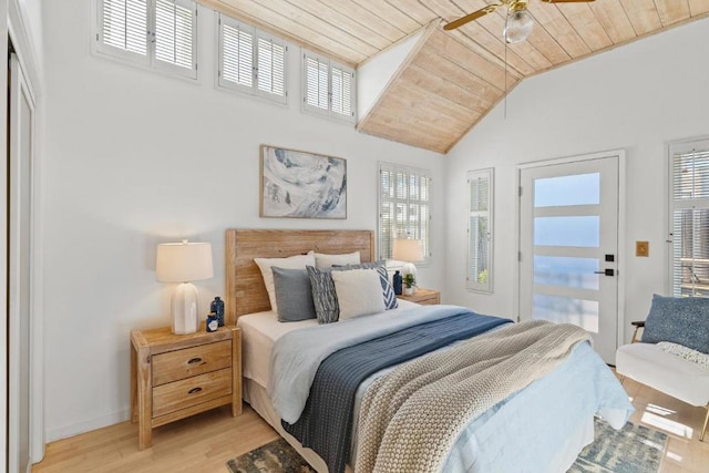 bedroom with vaulted ceiling, ceiling fan, light wood-type flooring, and wooden ceiling