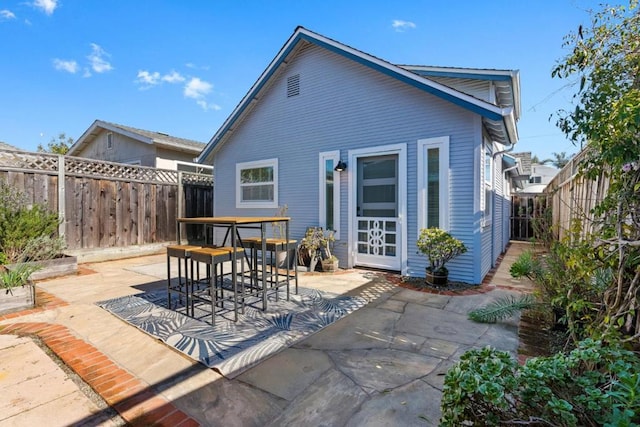 rear view of property featuring a patio area