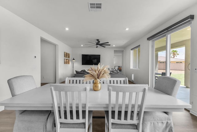 dining area featuring ceiling fan and wood-type flooring