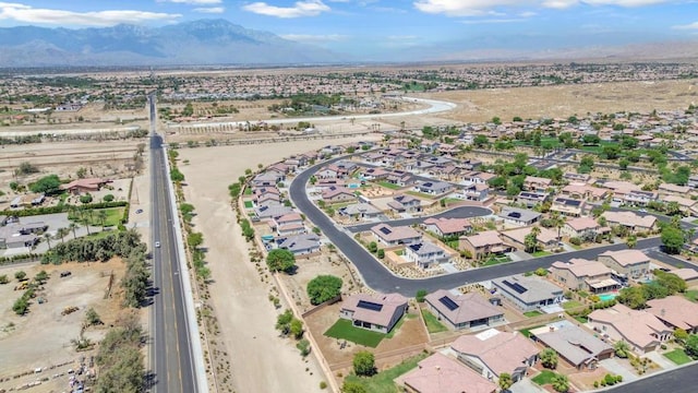 birds eye view of property with a mountain view