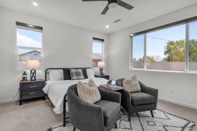 bedroom with light colored carpet and ceiling fan