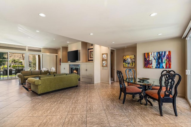 tiled dining area featuring a tile fireplace