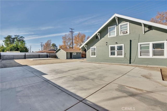 exterior space featuring a patio area and a storage unit