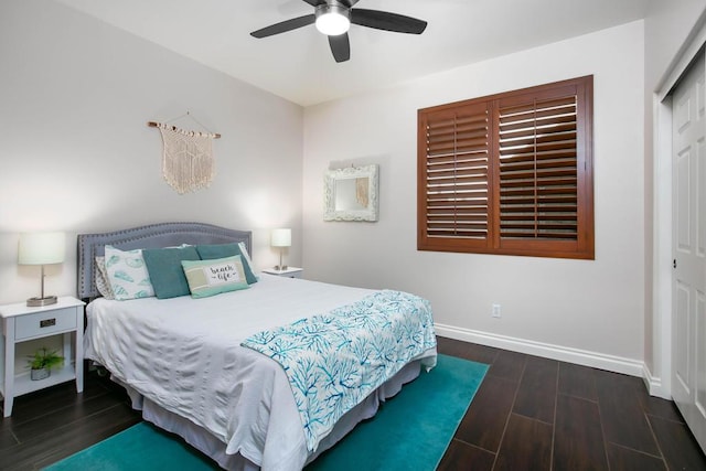 bedroom featuring ceiling fan, dark hardwood / wood-style flooring, and a closet