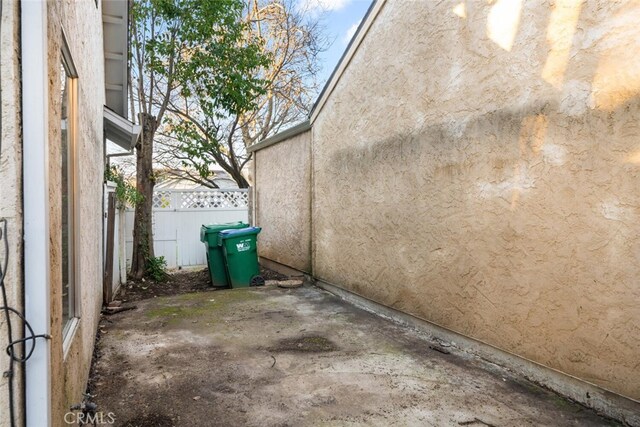 view of side of property featuring a patio area