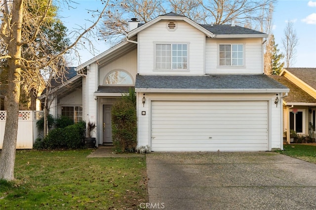 view of front of house featuring a garage and a front yard