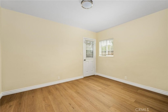 spare room featuring light wood-type flooring