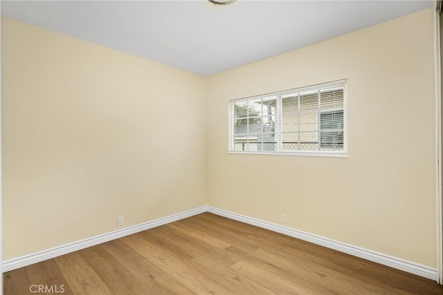 spare room with light wood-type flooring