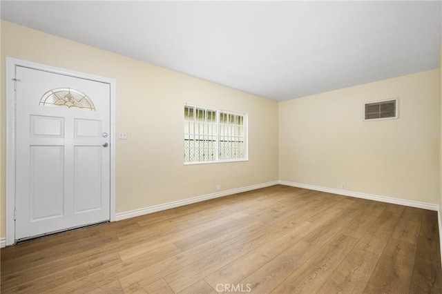 entryway with light hardwood / wood-style floors