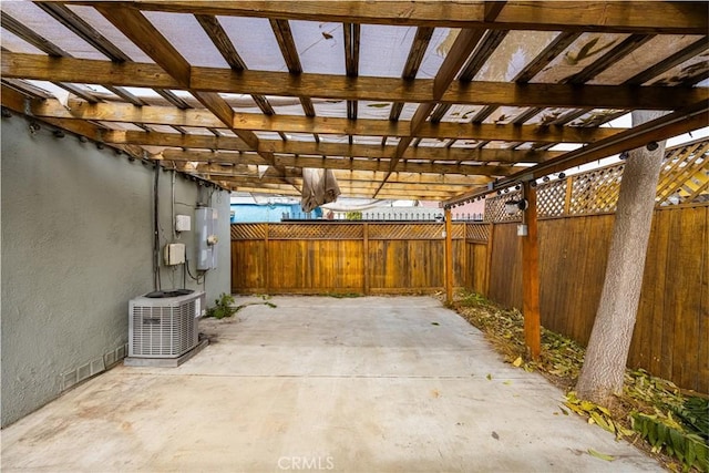 view of patio with a pergola and central AC